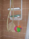 Over-the-showerhead-rack with bath pouf, washcloth, and scrubber mitt