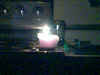 Teacup candle in darkness