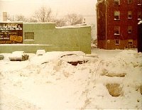 Snowy parking lot and back of our bldg.